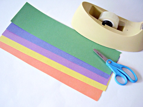 Paper and tape and a table fan are used in a wind experiment