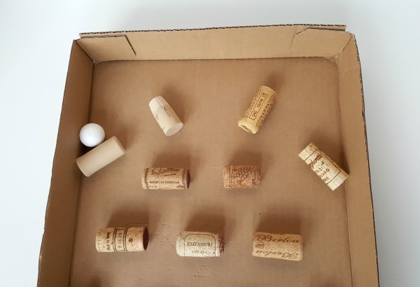 Use recycled corks to make a marble run