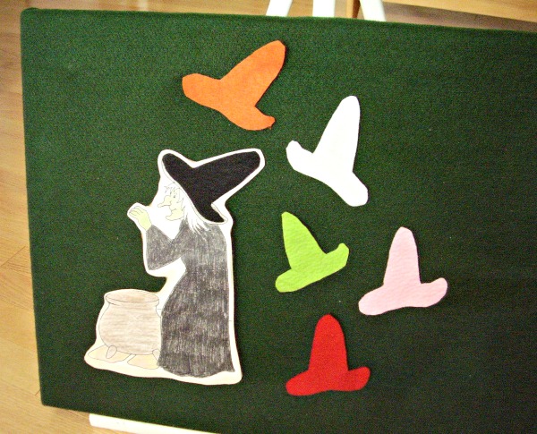 Story board with witch hats cut outs on the felt board