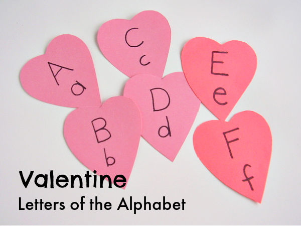 kids literacy play with heart shaped letters of the alphabet