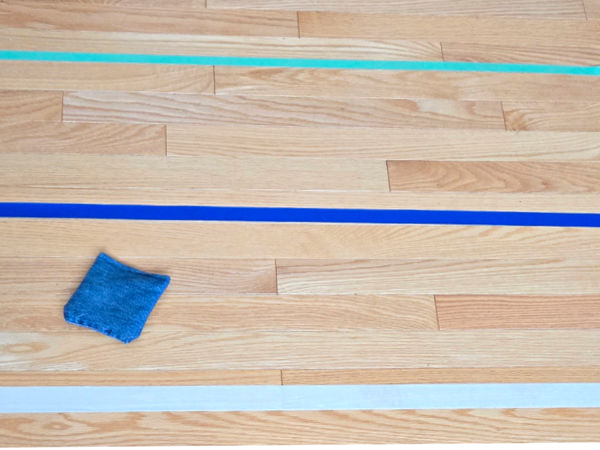 masking tape targets on the floor for kids bean bag games
