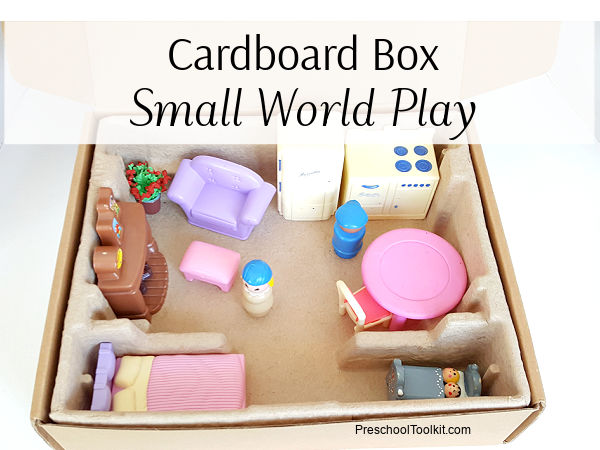 small world play with a cardboard packing box
