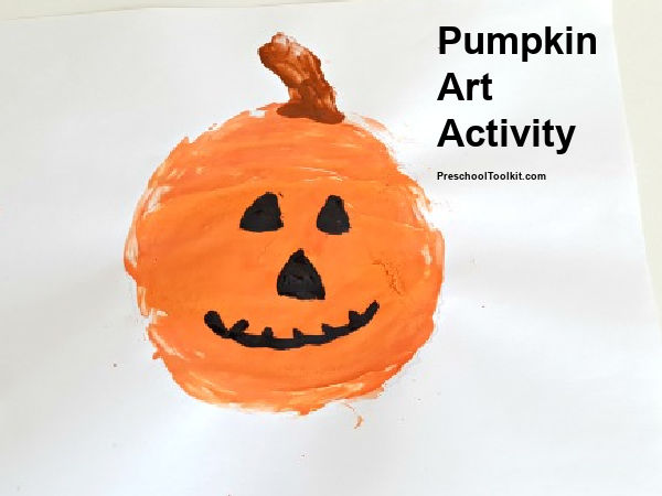 painting a pumpkin with a craft stick tool