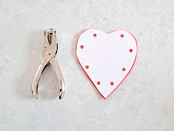 make holes in the heart shape with a hole punch for a lacing activity