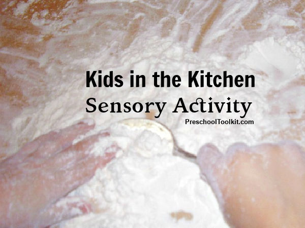 kids sensory activity with flour in the kitchen