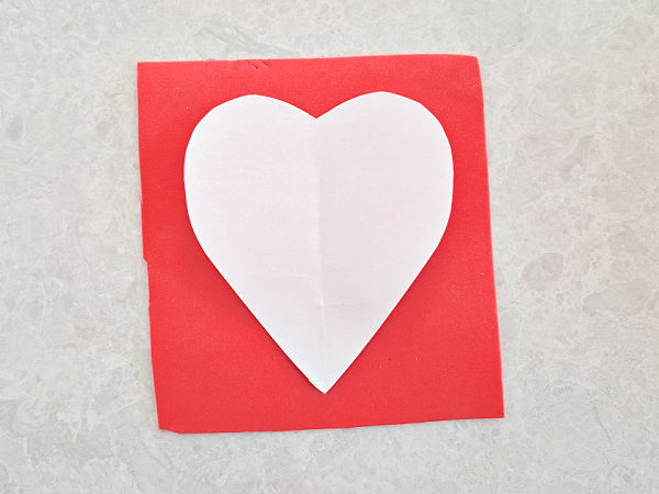 cut out a heart shape template for a Valentine Day craft
