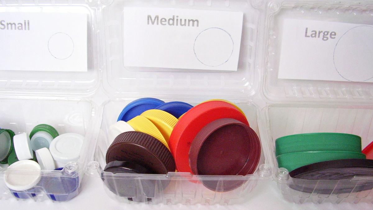 sort and count colors and sizes of jar lids with beginning math