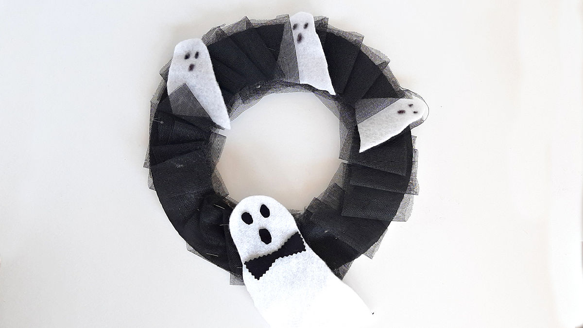homemade wreath made with recyclables for Halloween