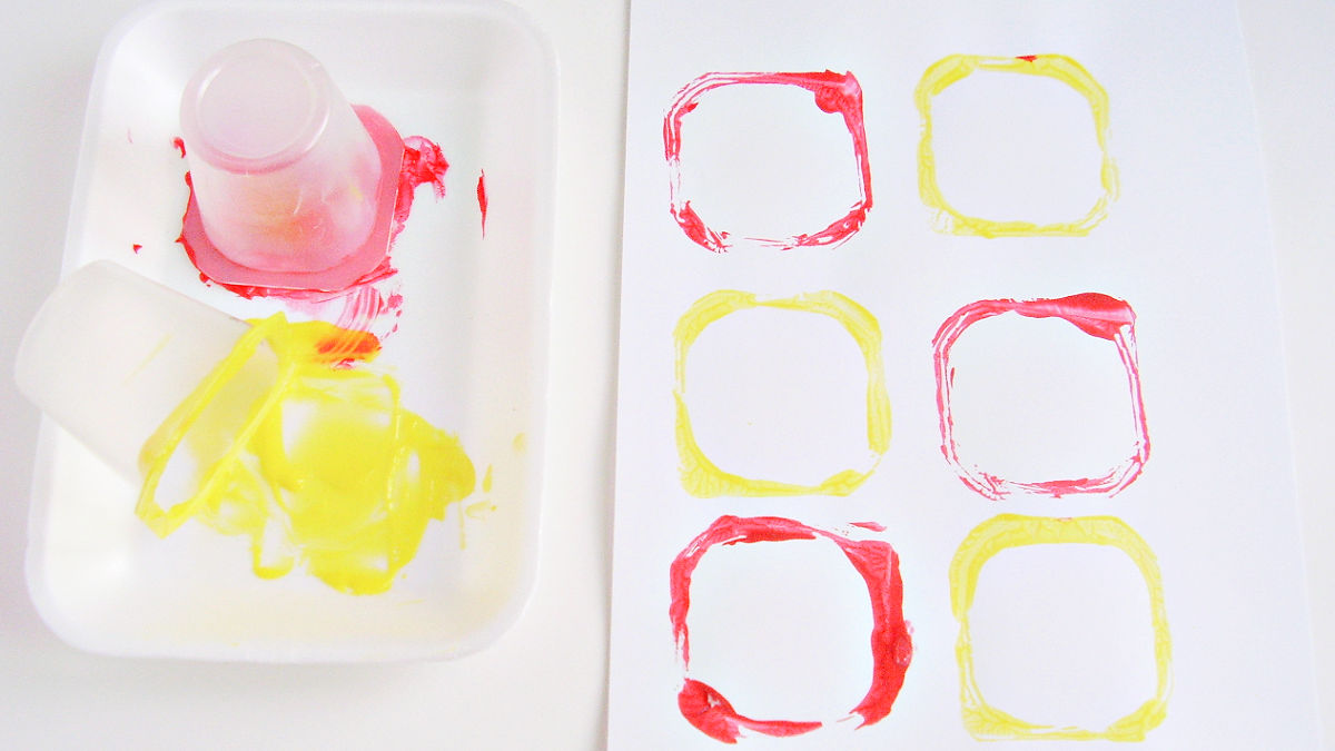 kids painting activity with recycled containers as paint brushes