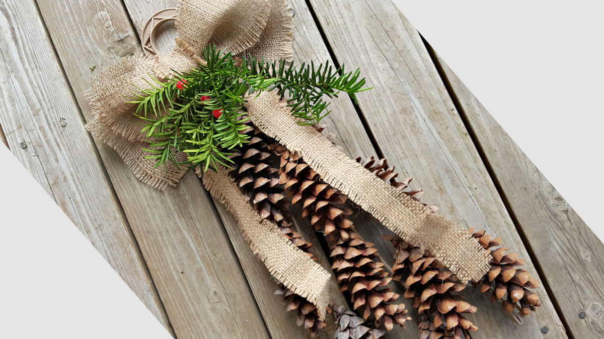 outdoor Christmas decoration made with pine cones and recyclables