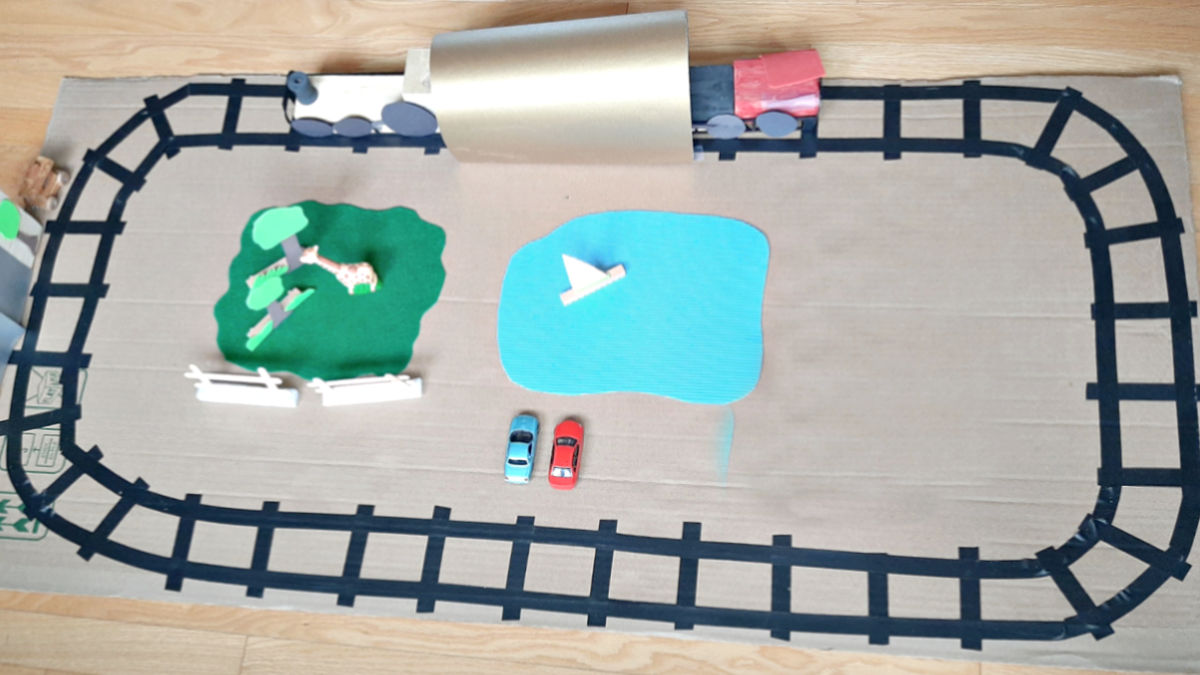 train track made with tape for pretend play with toy trains