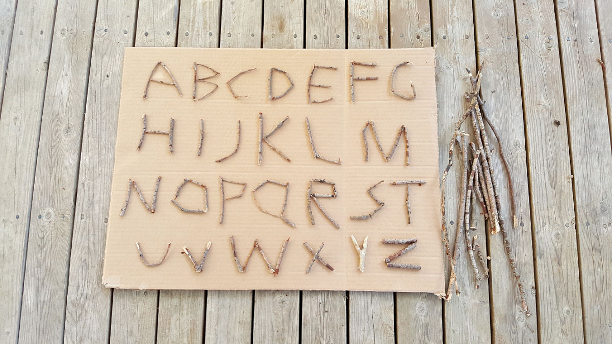 collect small branches to make letters of the alphabet for nature activity