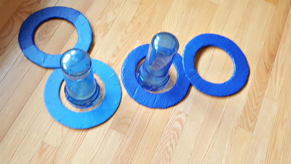 kids homemade game of toss with recycled materials