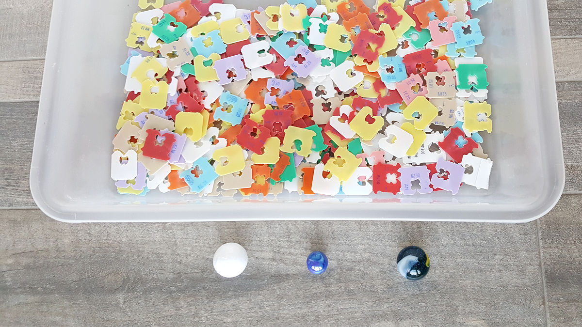 preschool science with marbles in the sensory bin