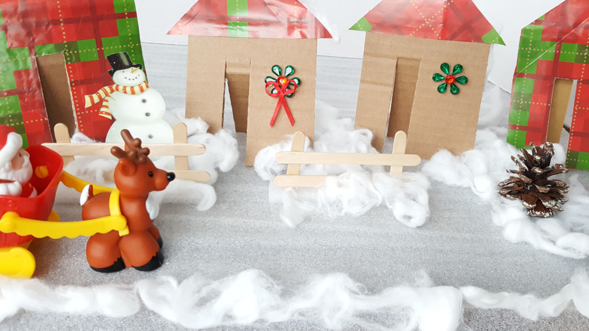 create a small world winter scene with cardboard houses
