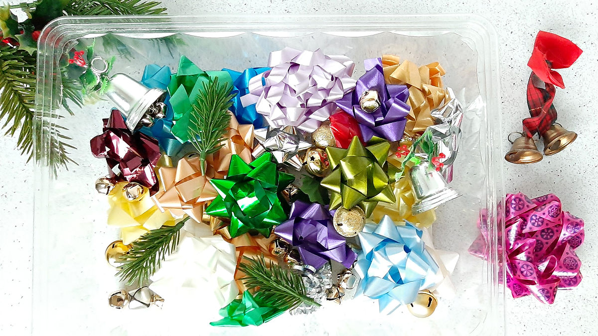 Christmas sensory bin idea with bells and bows