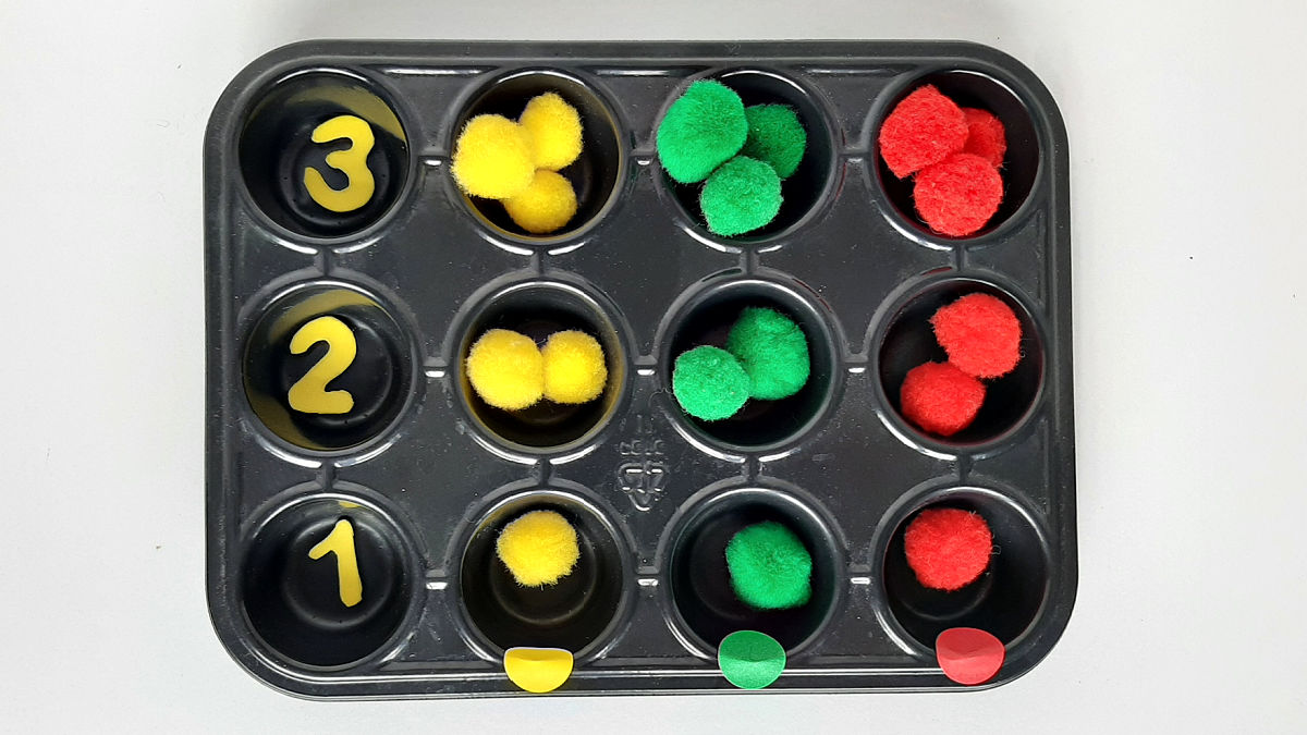 count pompoms and sort colors preschool math activity
