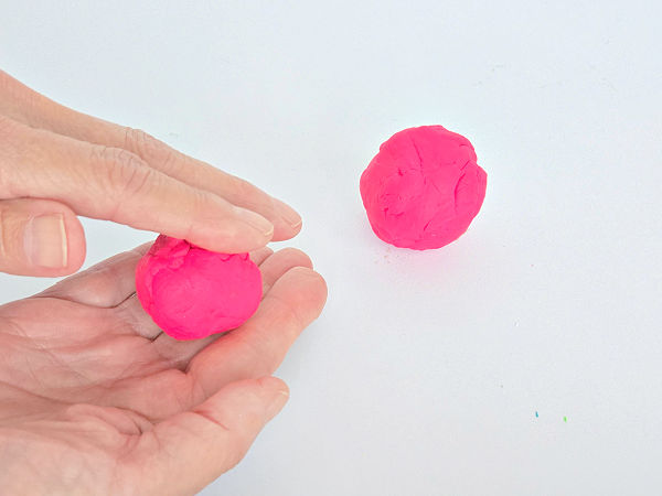 roll clay in your hands to make a playdough bird