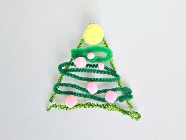 build a Christmas tree with loose parts like pipe cleaners and pompoms