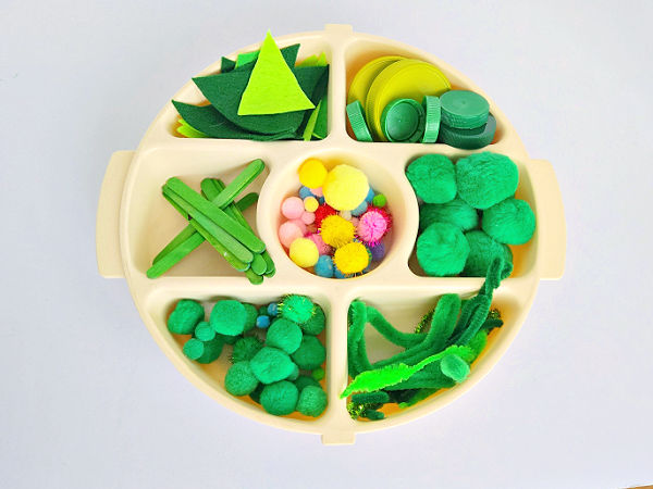 organize small parts in a divided tray for kids Christmas STEM activity