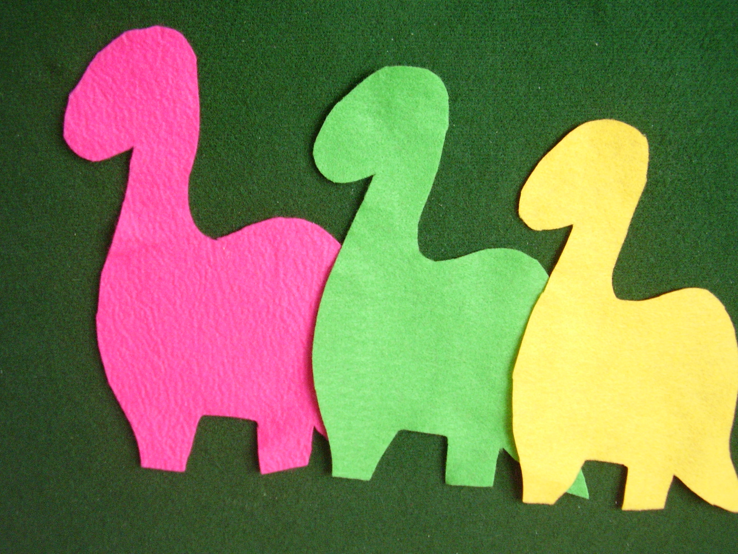 Felt dinosaur cut outs on the flannel board