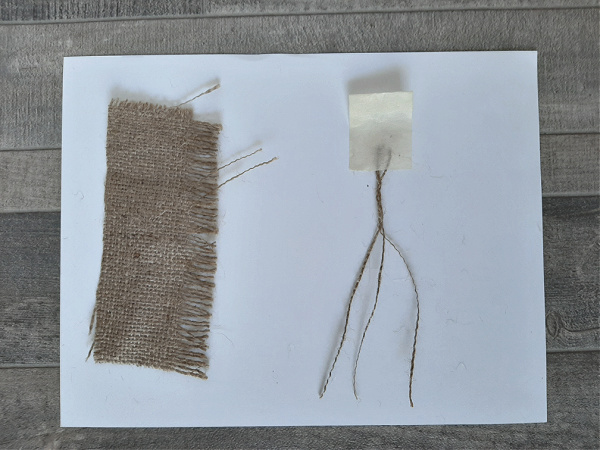 Burlap threads braided to make a hanger for a DIY ornament