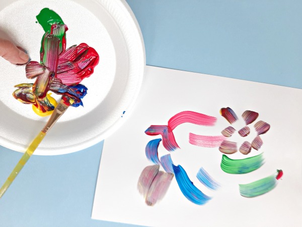 Mixing paint colors on a kids paint palette