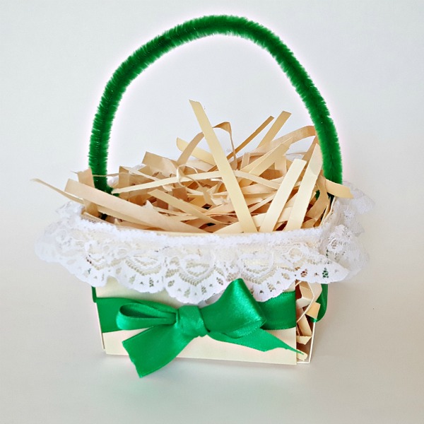 decorate a berry box with lace trim and a pipe cleaner handle