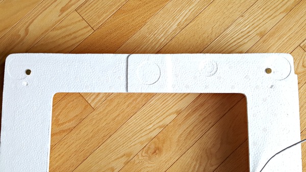 Front view of puppet theater with paper fasteners
