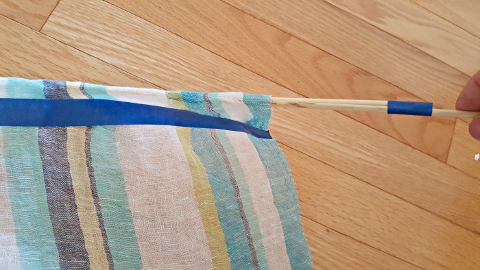 Insert rod into casing to make a curtain for the puppet theater