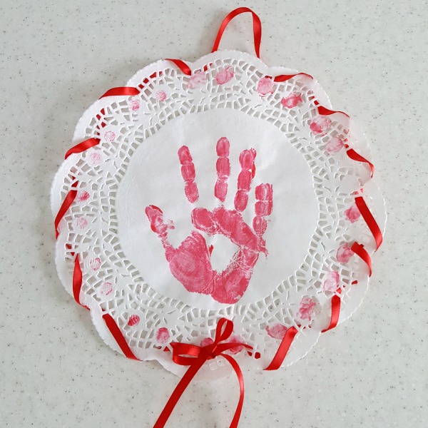 Paper doily handprint craft for kids