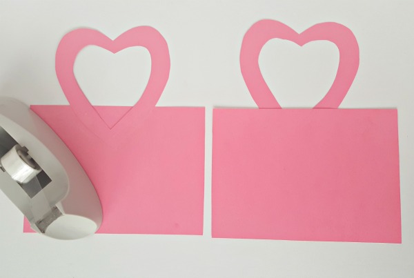 Tape handles to Valentine mailbag to make a preschool craft