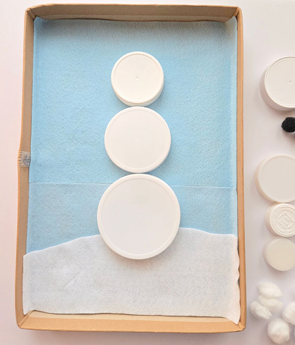 snowman STEAM building with jar lids