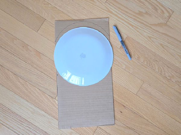trace around a small round plate to make a template for a doll bed headboard