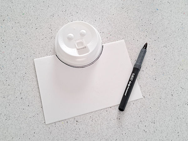 coffee cup lid snowman with felt scarf and paper cutouts